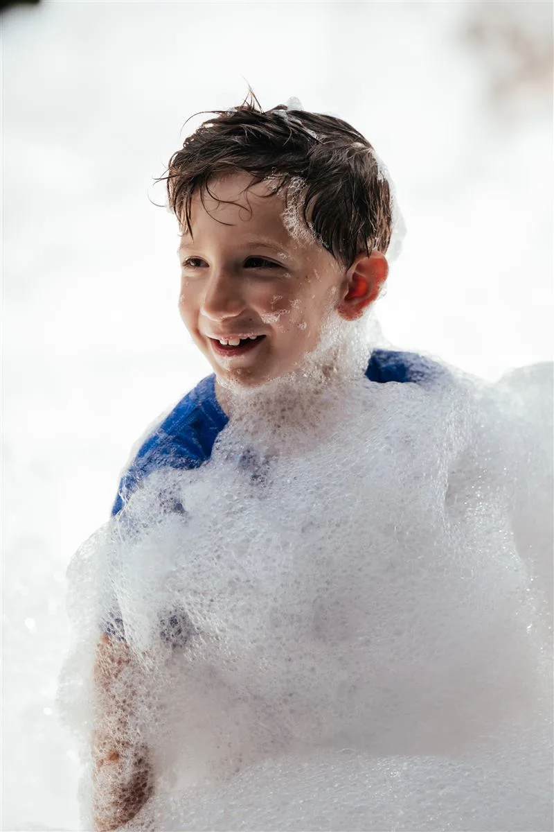 Foam party in full swing with a crowd of kids