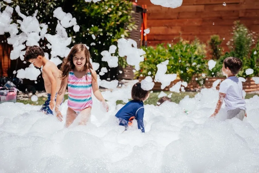 Kids playing in foam party