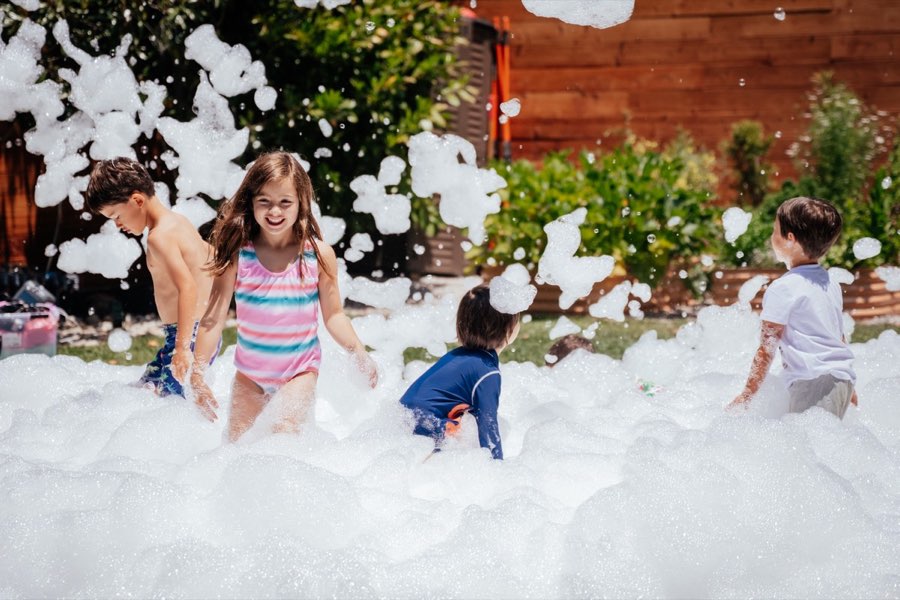 Kids playing in foam party