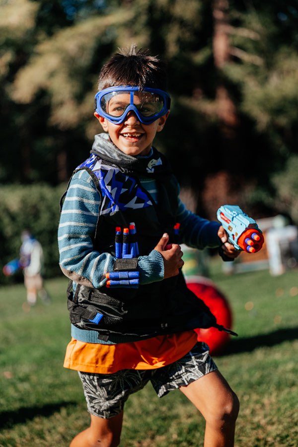 Kid with Nerf blaster gear